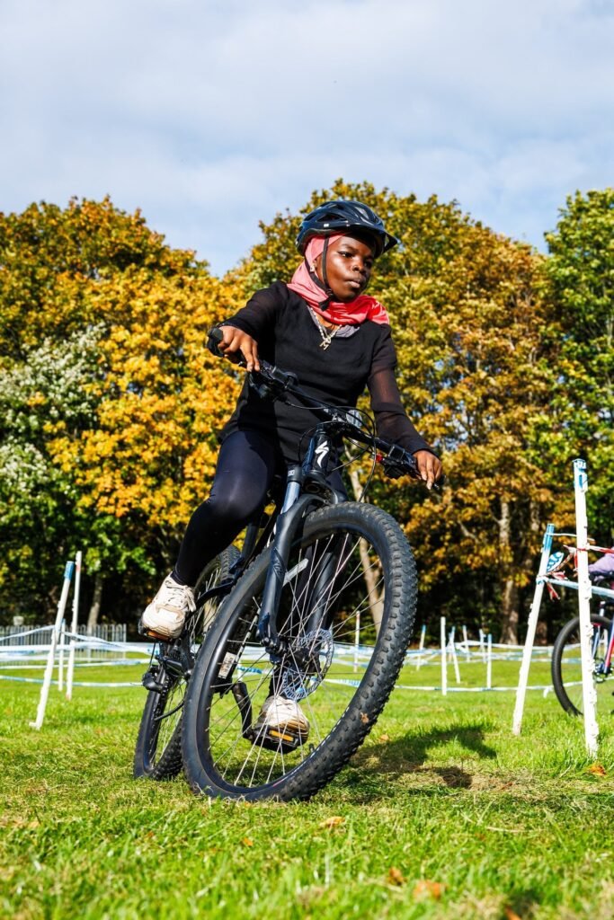 Young rider leaning into a bend on the grass course at Inch Park